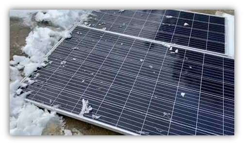 solar panel with enviromental factors such as winter with snow