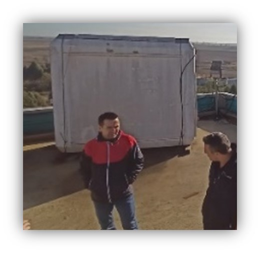 workers smoking on roof of a factory