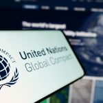 united nations global compact logo shown on phone